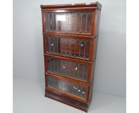 An early 20th century mahogany Globe-Wernicke four shelf sectional bookcase, with leadlight glazed doors and maker's label. 8