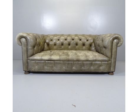 A green button-back leather upholstered chesterfield sofa. 174x70x90cm 