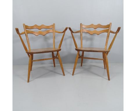 A pair of mid-century Ercol easy chairs in elm and beech. 