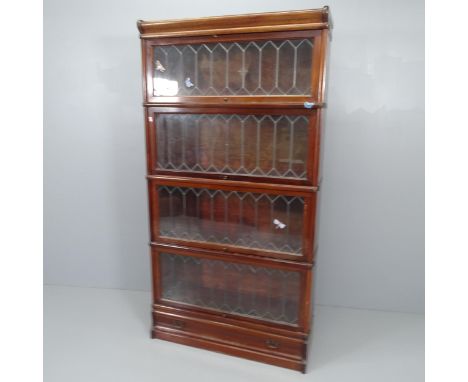 An early 20th century mahogany Globe-Wernicke four shelf sectional bookcase, with leadlight glazed doors and maker's label. 8