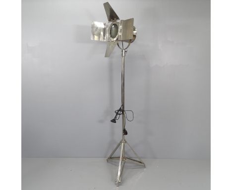 A modern chrome standard lamp in the form of a theatre spotlight. Height 170cm 