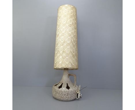 A mid-century West German pottery floor lamp with original shade. Height overall 144cm.Base has been broken and repaired. Lig