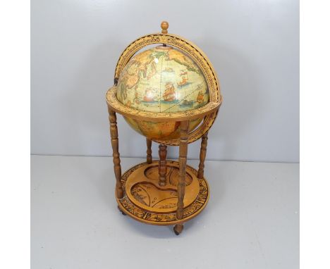 A terrestrial globe-design drinks trolley. Height 95cm. 