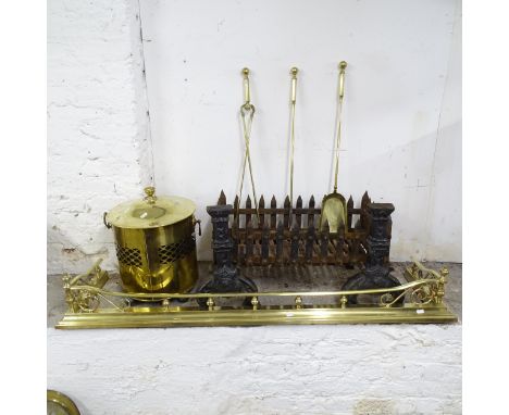 A cast iron ducks nest fire grate, W 140cm, two fire dogs, a brass companion set, fire surround and coal bin. 