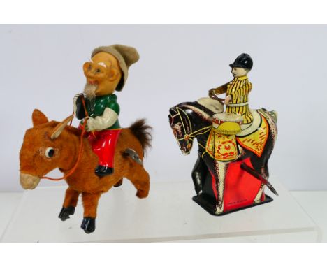 Fuji / Fuji Press - Wells Brimtoy - Two unboxed vintage wind-up toys. Lot consists of a Japanese tinplate wind-up 'Dwarf Ride