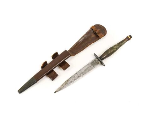 A Second World War Fairbairn Sykes Fighting Knife, Second Pattern, the 16cm hand forged steel blade with recessed panel to th