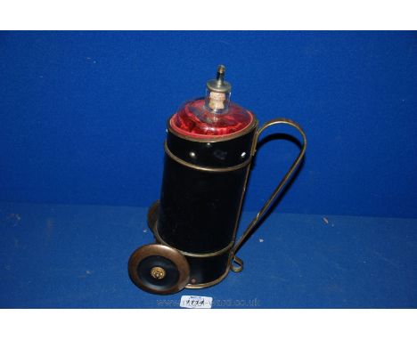 A vintage musical Golf Caddie with glass decanter.