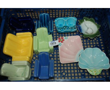 A quantity of Pipe rests shaped as Art Deco chairs and four others.