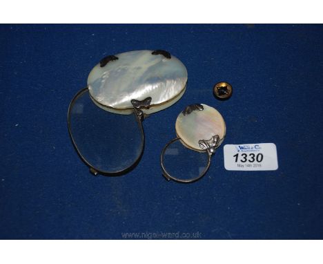 Two Silver and Mother of Pearl folding magnifying Glasses and a tiny compass.
