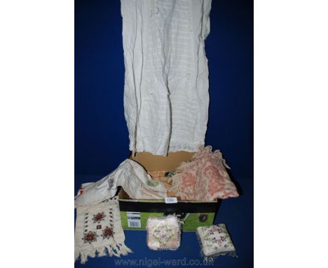 A vintage baby's linen gown, two embroidered and beaded Pin Cushions, drawstring pouch etc.