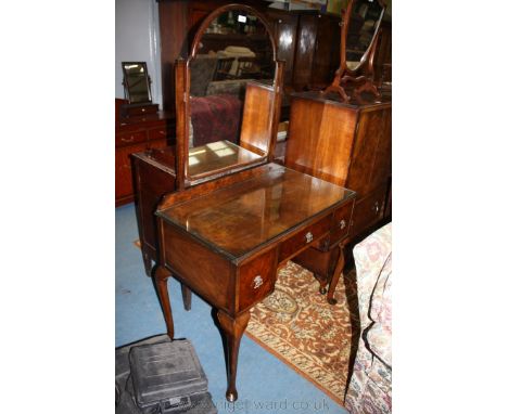 A Walnut Kneehole Dressing Table by Palatial Furniture having an arch top mirror in square supports, with rectangular moulded