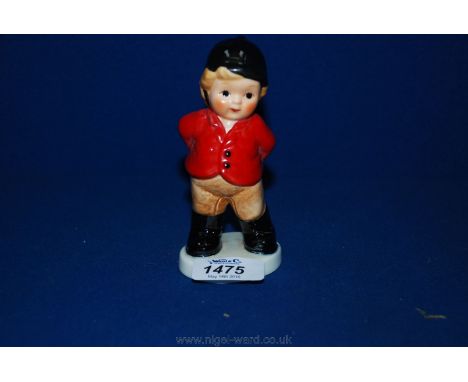 A Hummel figure of a Girl in Hunting Pink.