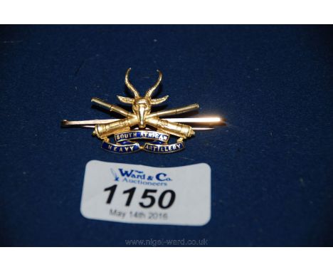 A 15ct gold and enamel 'South African Heavy Artillery' cap Badge.