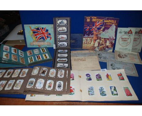 A quantity of old Cigarette Card Albums including Radio Celebrities, Safety First, Film Stars, George V Silver Jubilee, Regim