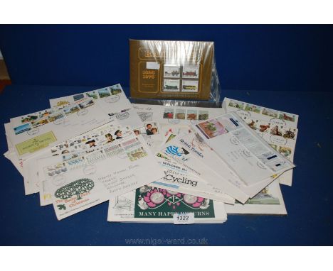 A quantity of First Day Covers including Year of the Child , 'British Wildlife', etc and presentation packs of stamps.