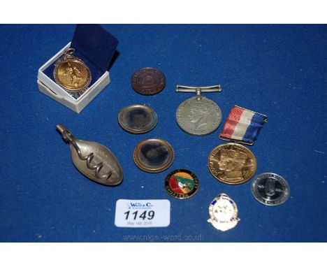 An un-named WWII medal, a Coronation Medal, miscellaneous enamel Badges and a Spoon with a corkscrew advertising various poti