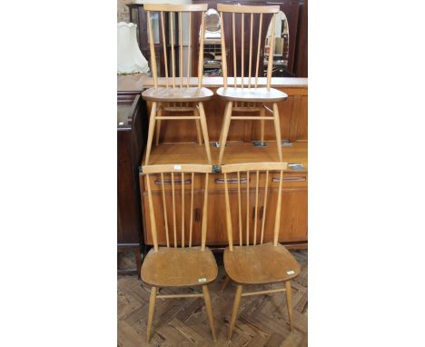 A set of four mid Century beech and elm Ercol dining chairs, model no. 2056