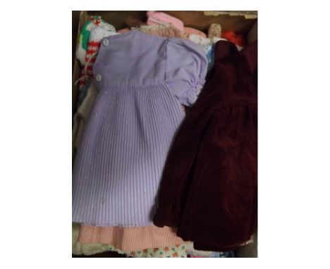 A box containing a large quantity of assorted vintage doll s clothing  