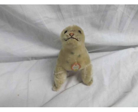 A mid-20th Century Steiff Robby Seal in cream cut mohair with chest tag, height 5"   