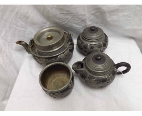 Oriental Pewter tea service comprising Tea Pot, Hot Water Jug, covered Sugar Bowl and further Bowl, (4) 