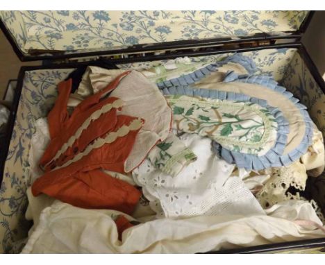 A trunk containing a large quantity of assorted vintage hand-made doll s clothing  