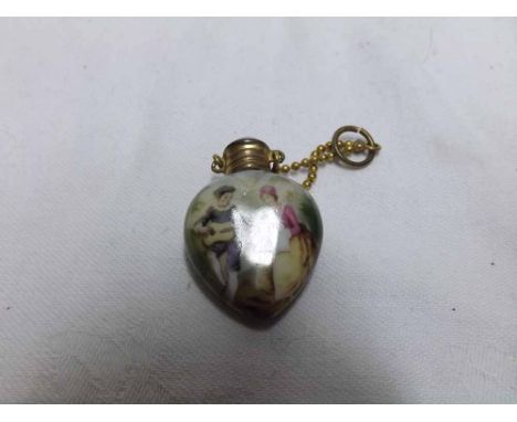 Late 19th/early 20th Century heart-shaped ceramic Scent Bottle, painted with a musical couple in wooded landscape, metal fixi