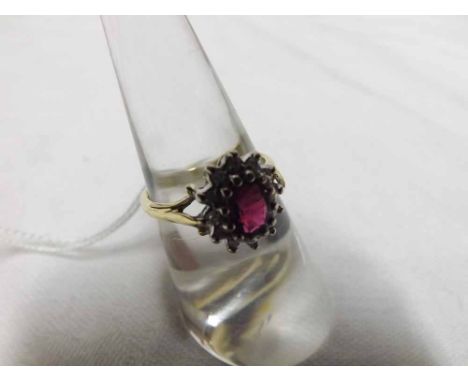 Hallmarked 18ct Gold centre Ruby and small brilliant cut Diamond surround Cluster Ring  