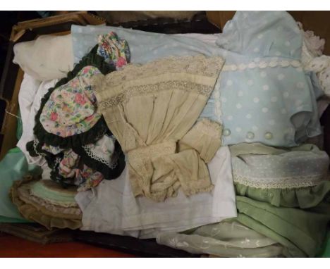 A box containing a large quantity of assorted vintage and hand-made doll s clothing  