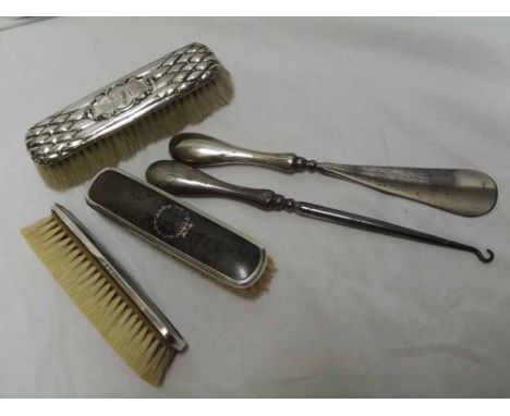 A Mixed Lot comprising: three assorted Silver-Backed Dressing Table Brushes, together with a further Silver-Handled Button Ho