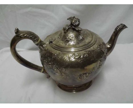 Victorian squat Silver Teapot fitted with scrolled handle and hinged lid with flower shaped finial, the body decorated all ov