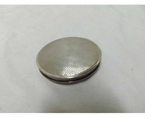 Circular Silver powder compact, the body decorated with engine turned detail, fitted with internal mirror, hallmarked Birming