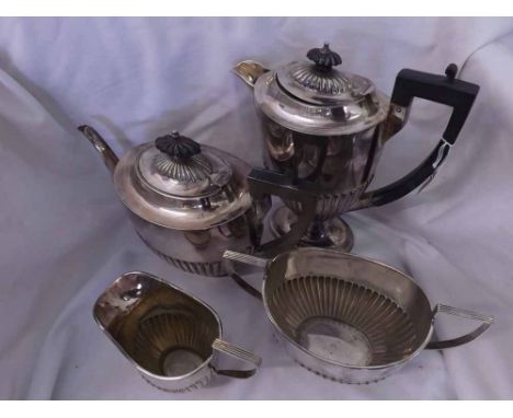 A late 19th or early 20th Century Four Piece Silver Plated Tea Set, comprising teapot, hot water jug, milk jug and sugar basi