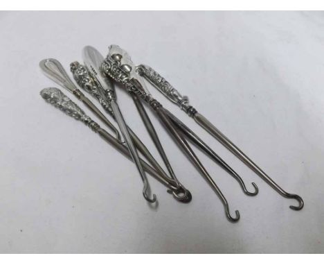 Mixed lot comprising eight assorted Steel and Silver handled button hooks of varying designs to include examples with foliate