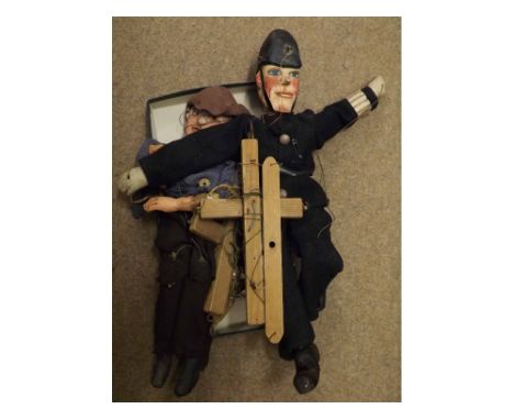 Two Vintage puppet/Marionettes, one of a Policeman, carved wooden painted face on articulated carved wooden body, in Policema
