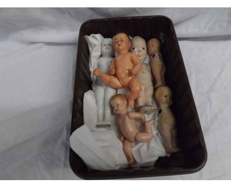 A Tray containing six assorted Dolls, to include two Celluloid Thumbs Up; Japanese All China Doll; Kewpie type Dolls etc (qty