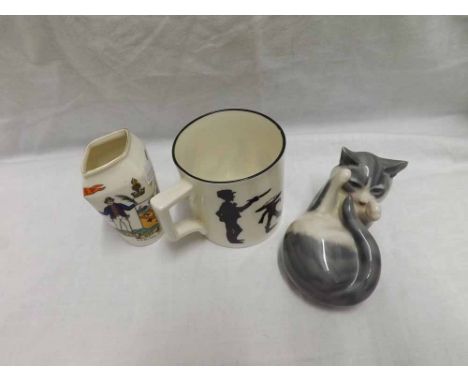 Small Royal Copenhagen model of a cat, further W H Goss mug decorated with nursery rhymes, silhouettes and inscribed  Poor Mi