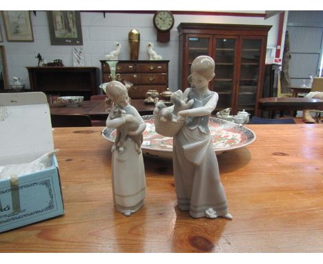 Three Lladro figures - Girl with Basket of puppies, Girl with Lamb and a Goose