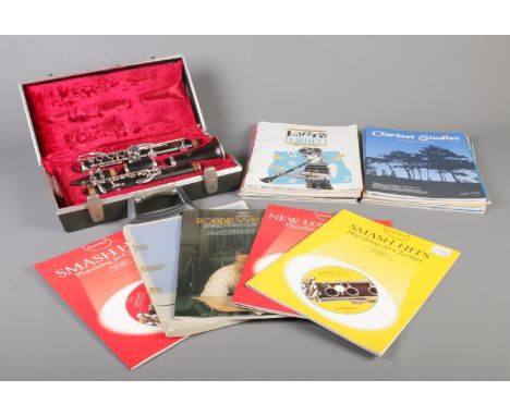 A Le Blanc Sonata Clarinet in B&amp;H Bandhite case, together with a collection of Clarinet sheet music.  