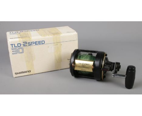 A Shimano TLD 30 2 Speed fishing reel, complete with instruction leaflet and box.  