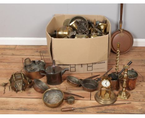 A large box of metalwares. Including Eastern brassware, oil lamp fonts, water jugs, kettles, etc.  