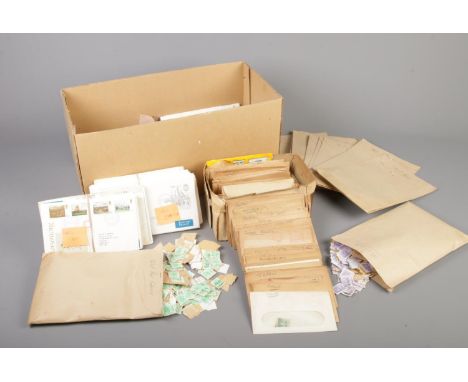 A box containing a very large quantity of loose GB stamps, along with approximately 85 first day covers from the 1970's and 8