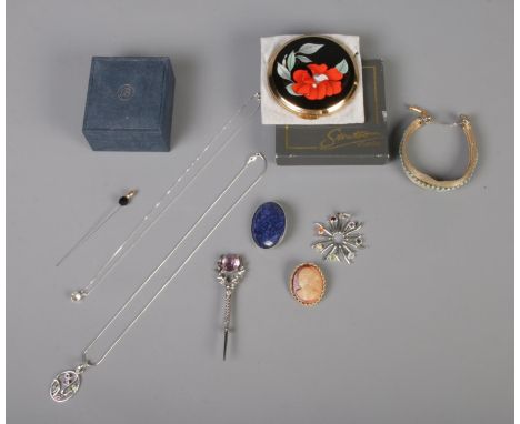 An assortment of jewellery and accessories. To include two sterling silver necklaces, a boxed Stratton compact, brooches and 