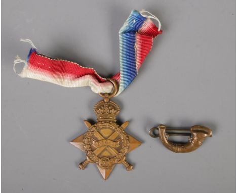 A 1914-15 Star Medal, awarded to SPR. E.W. Capeling 7412, together with a small bugle badge.  