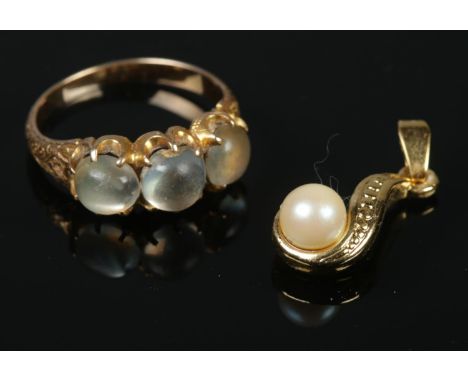 A yellow metal Moonstone ring and yellow metal faux pearl pendant. Ring Size: M1/2. Gross weight: 4.41g.  Both items boxed.