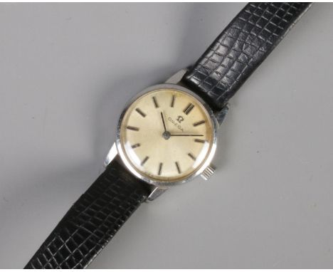 A ladies Omega manual wind wristwatch, with satin dial and baton markers. In working order.  