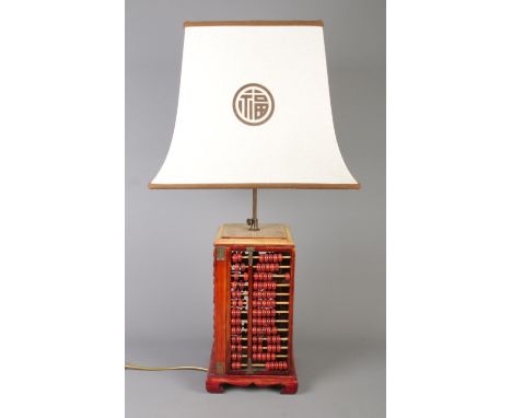 A vintage two bulb Chinese hardwood abacus table lamp.  82cm high.  