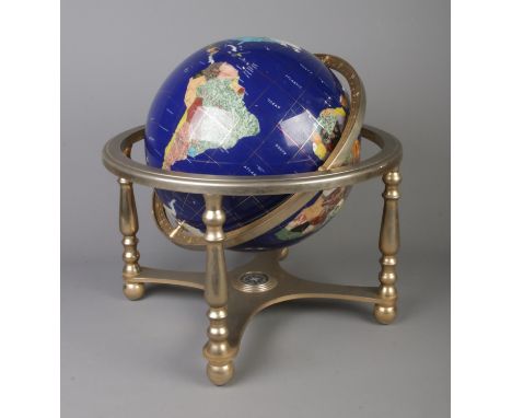 A large Gemstone Globe depicting the countries of the World in minerals and semi -precious stones. H: 44cm.  Has built in com