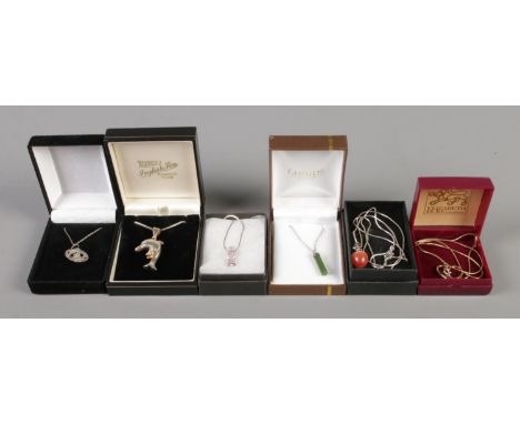 A collection of six silver pendant necklaces, to include dolphin and jade examples.  