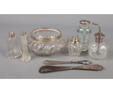 A collection of silver mounted items. Includes atomiser, glass bowl, shoe horns etc.  