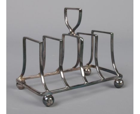 A late Victorian silver five bar toast rack, assayed for London, 1899 by Haseler Brothers. Total weight: 92g  